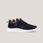 Navy blue shoes with white soles on a light gray background